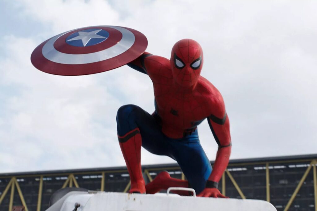 Peter Parker/Spider-Man (Tom Holland) holding Captain America's shield in "Captain America: Civil War" | Credit: Marvel Studios